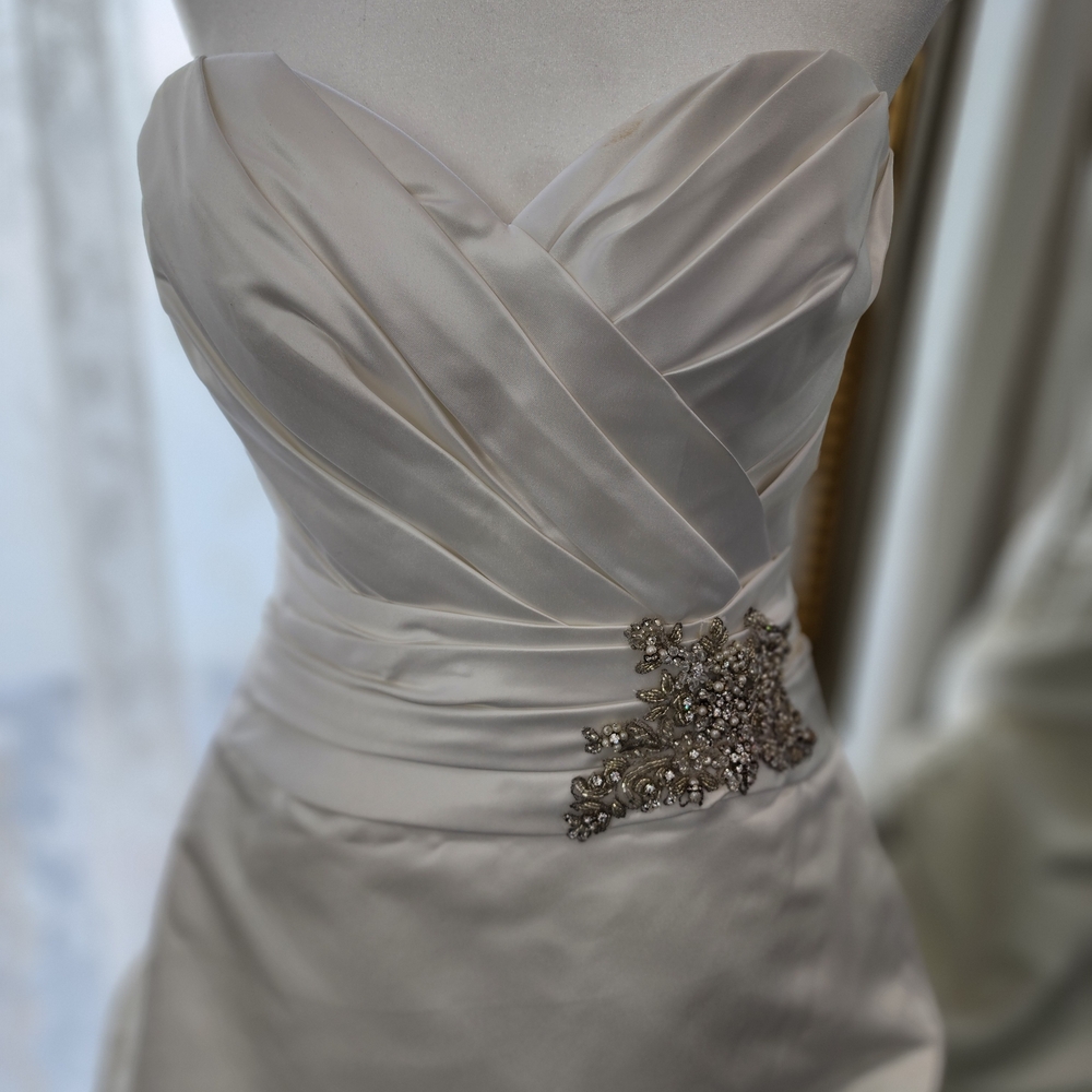 Elegant Cream Satin Wedding Dress with Embellished Detail